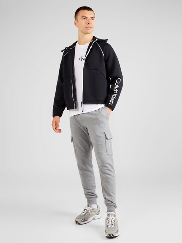 UNDER ARMOUR Tapered Sporthose 'Rival' in Grau