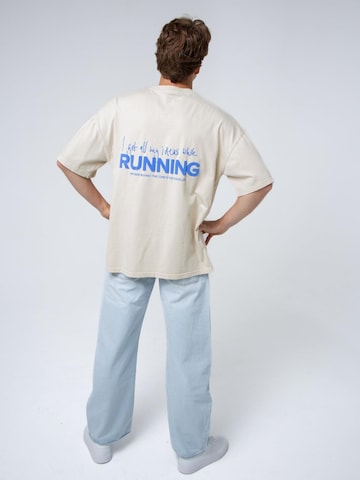 BAYSIDE BOUND Oversizeshirt 'THE RUNNING UNISEX OVERSIZE TEE'‌‌‌‌‌‌ in Beige