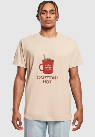 T-Shirt 'Caution Hot' Merchcode en beige : devant