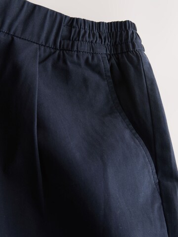 Next Ohlapna forma Chino hlače | modra barva