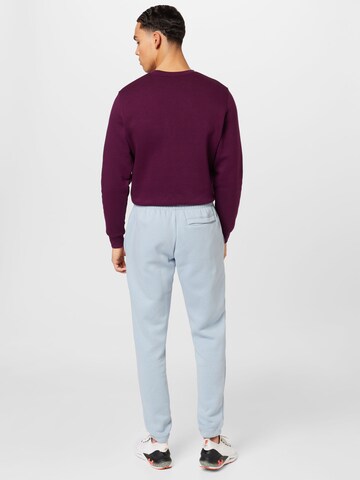 Effilé Pantalon de sport 'Essential' UNDER ARMOUR en bleu