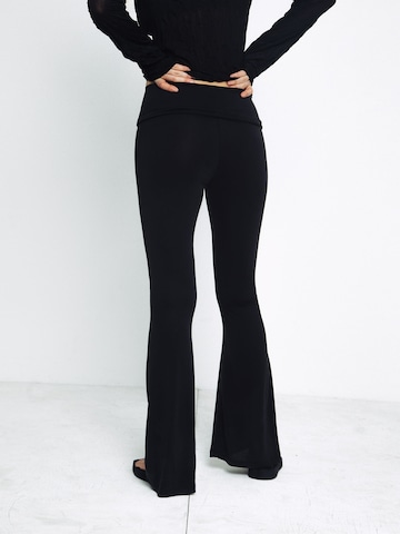 ABOUT YOU x Toni Garrn Flared Trousers in Black