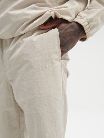 Sinned x ABOUT YOU Regular Trousers 'Hannes' in Beige