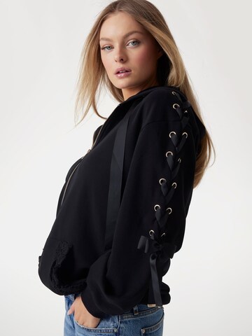 GUESS Sweatjacke in Schwarz