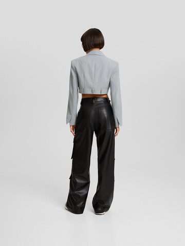 Bershka Loose fit Cargo trousers in Black