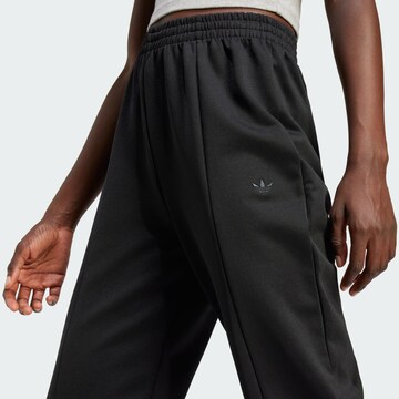 Flared Pantaloni di ADIDAS ORIGINALS in nero