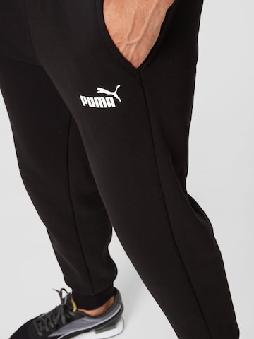 PUMA Tapered Sportbroek in Zwart