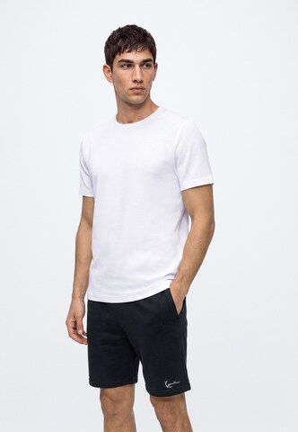 Karl Kani - regular Pantalón 'Signature' en negro