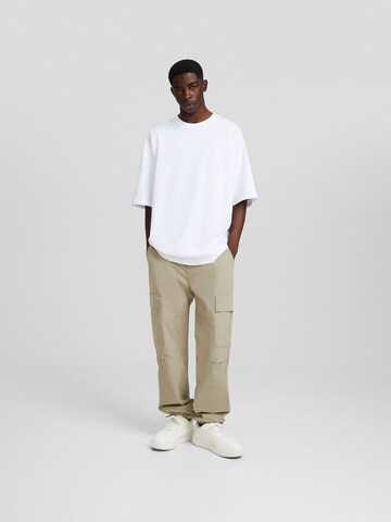 Bershka Loose fit Cargo trousers in Brown