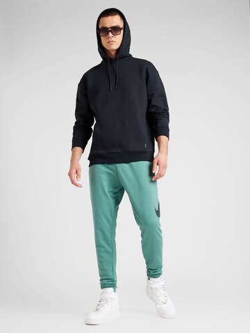 NIKE Tapered Sportbyxa i grön