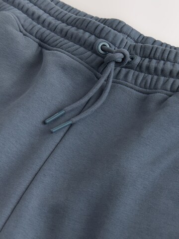 Next Tapered Hose 'Active Training Division' in Grau