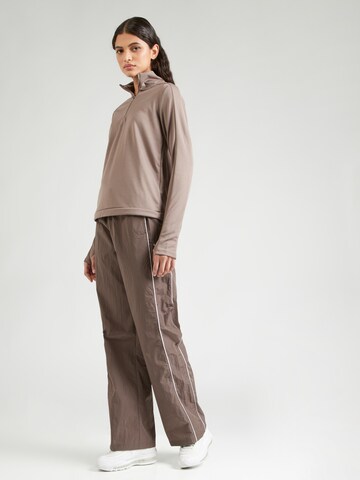 NIKE Funktionsbluse 'Pacer' i brun