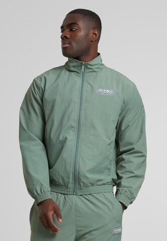 Karl Kani Between-Season Jacket in Green: front