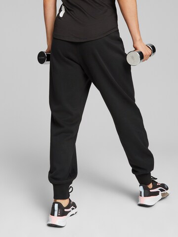 Tapered Pantaloni sportivi 'Train Favorite' di PUMA in nero