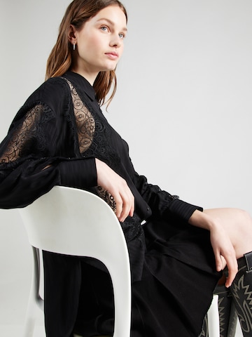 Sisley - Blusa en negro