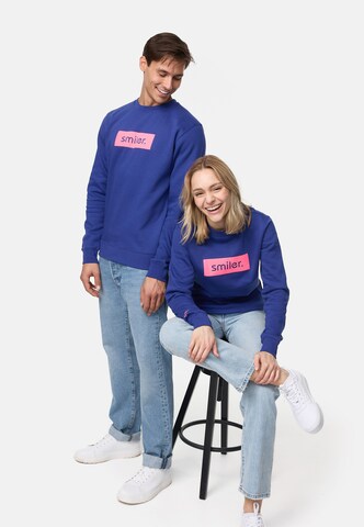 Sweat-shirt smiler. en bleu