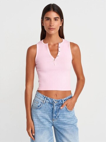 Top di Dilvin in rosa