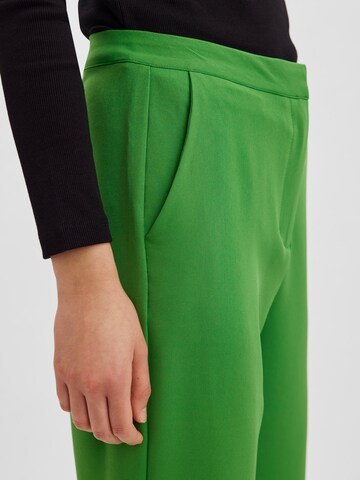 VERO MODA Normalny krój Spodnie 'Rue' w kolorze zielony