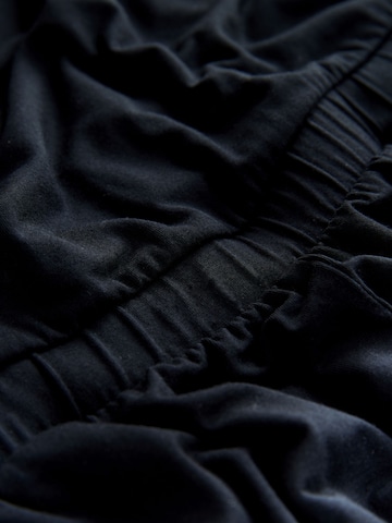 Next Kombinezon | črna barva