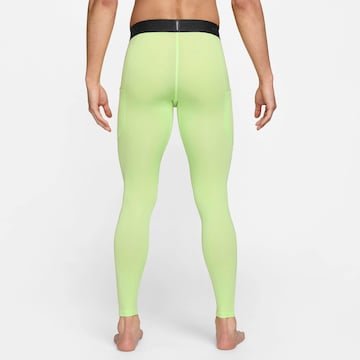 NIKE Skinny Workout Pants in Green