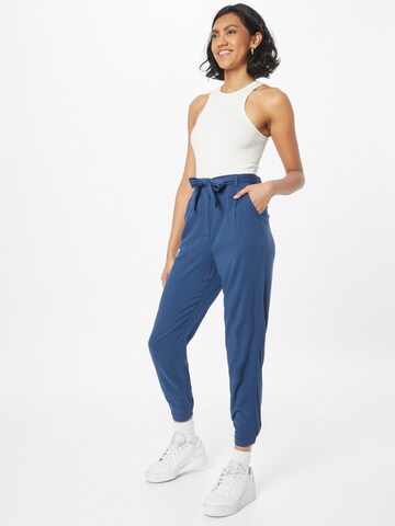 GREENBOMB Tapered Pleat-Front Pants in Blue