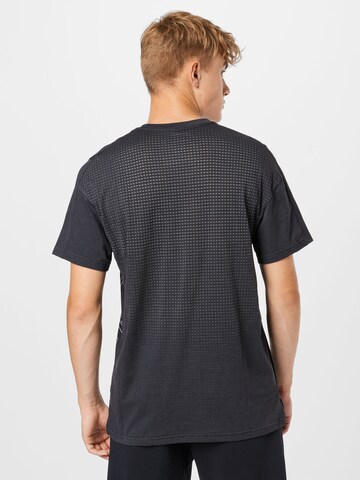 NIKE Koszulka funkcyjna 'BURNOUT' w kolorze czarny