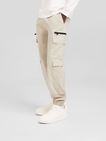 Bershka Tapered Cargo Pants in Beige