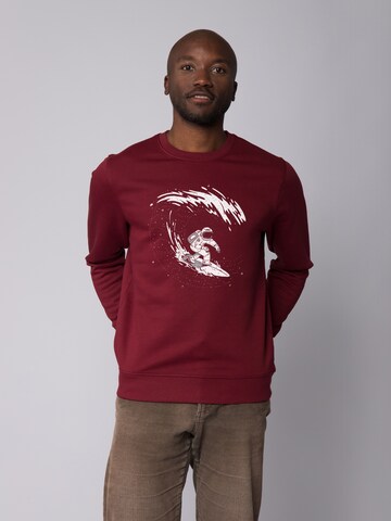 Watapparel Sweatshirt ' Surfing Spaceman ' in Rood: voorkant