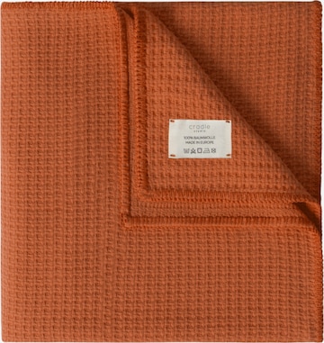 Cradle Studio Blankets in Orange: front