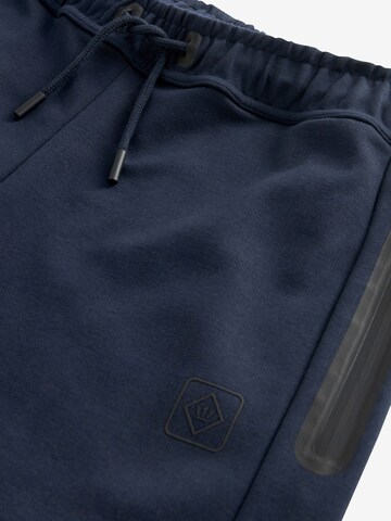 Next Tapered Weatherproof pants in Blue