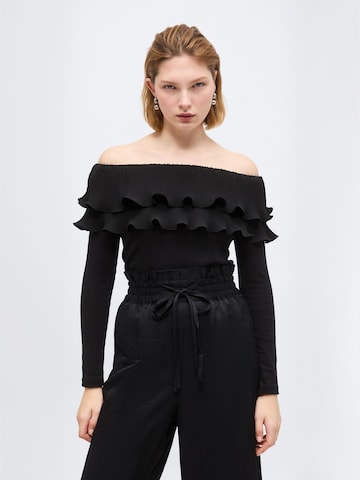 Top ' Flouncecras ' di Crās in nero: frontale