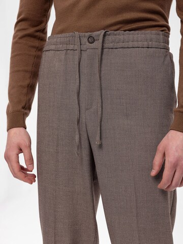 Antioch Tapered Trousers with creases in Beige