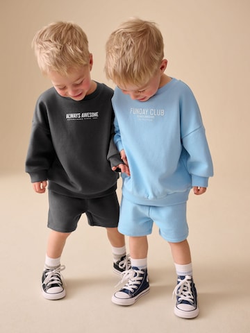 Next Träningsoverall i blå