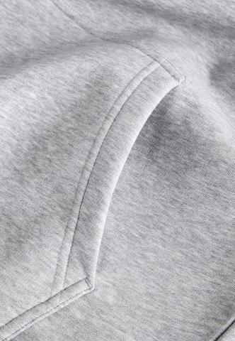 Sweat-shirt PEAK PERFORMANCE en gris
