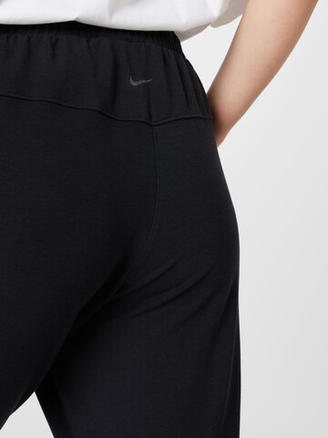 Nike Sportswear Tapered Workout Pants in Black