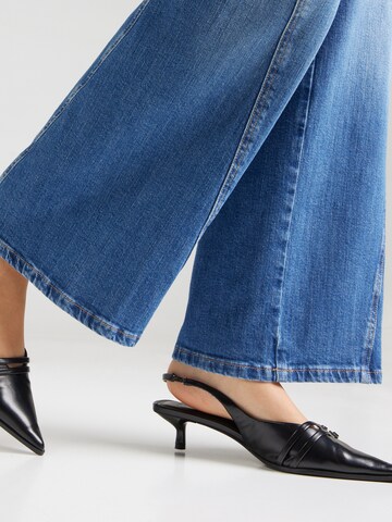 GUESS JEANS Široke hlačnice Kavbojke | modra barva