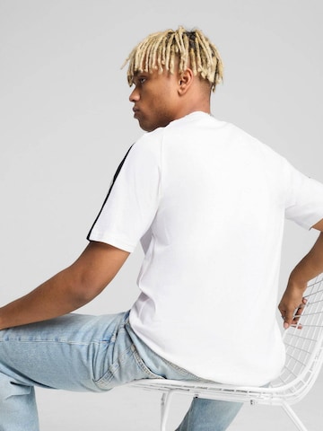 PUMA - Camiseta 'Puma T7 Tee' en blanco