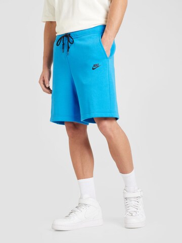 Loosefit Pantaloni de la Nike Sportswear pe albastru: față