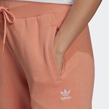 ADIDAS ORIGINALS Tapered Trousers in Orange