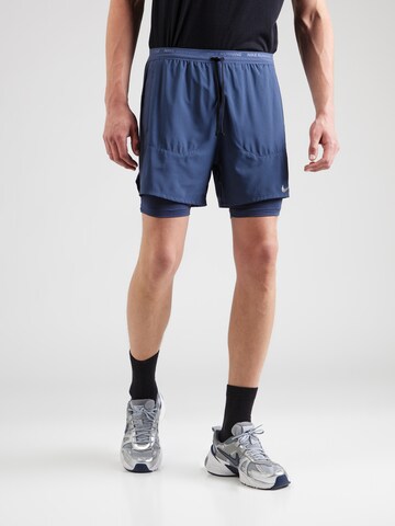Regular Pantalon de sport 'STRIDE' NIKE en bleu : devant