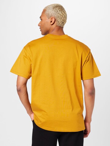 Carhartt WIP - Camisa 'Chase' em amarelo