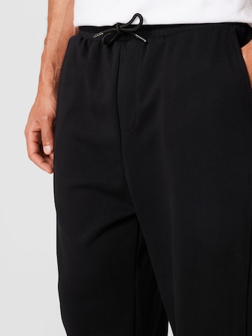 Urban Classics - regular Pantalón '90‘s' en negro