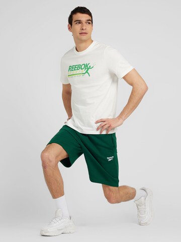 Reebok Normalny krój Spodnie sportowe w kolorze zielony