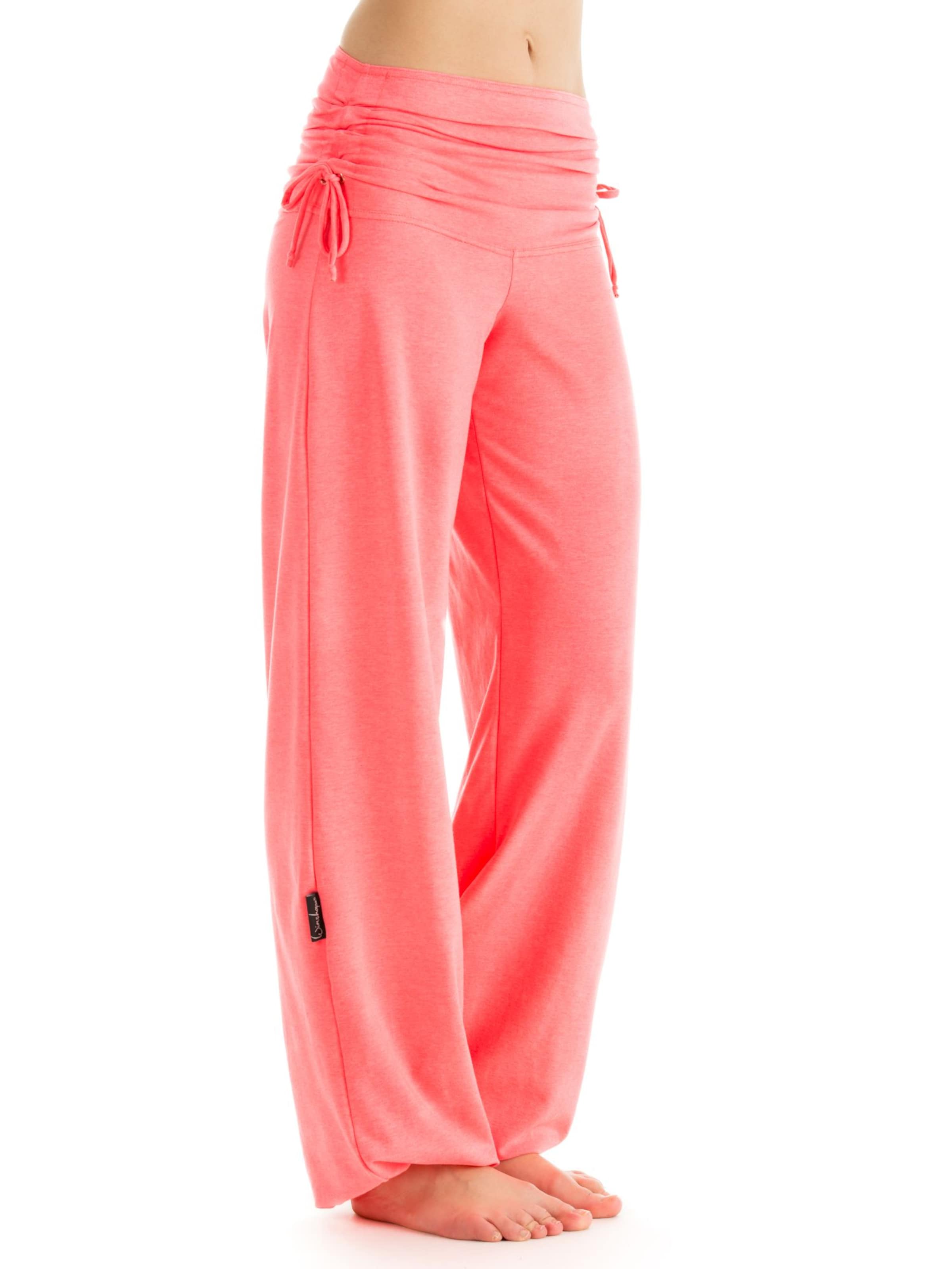 Winshape Дънки Tapered Leg Спортен панталон 'WH1' в оранжево