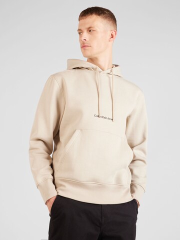 Sweat-shirt Calvin Klein Jeans en beige : devant