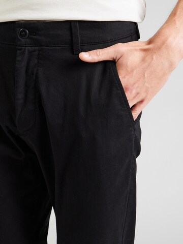Tapered Pantaloni chino di Calvin Klein Jeans in nero