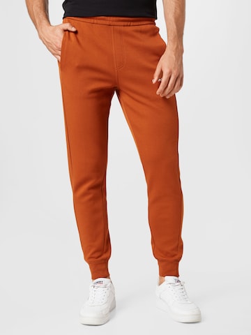 Calvin Klein Kalhoty – hnědá: přední strana