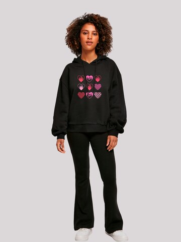 Sweat-shirt 'Internationaler Frauentag: Herzen in Flammen' F4NT4STIC en noir