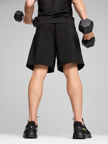 PUMA Loosefit Sportsbukser 'TRAIN FAV BLASTER' i sort