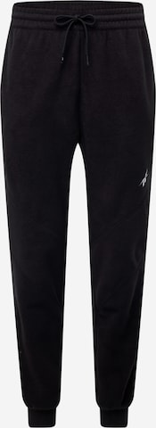 Effilé Pantalon de sport Reebok en noir : devant